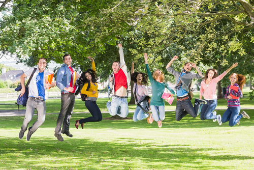 Holistic Nutritionist Community Jumping for joy in park